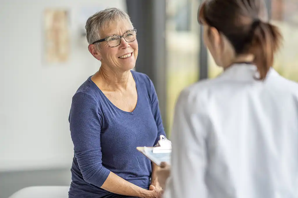 happy patient talking with nurse
